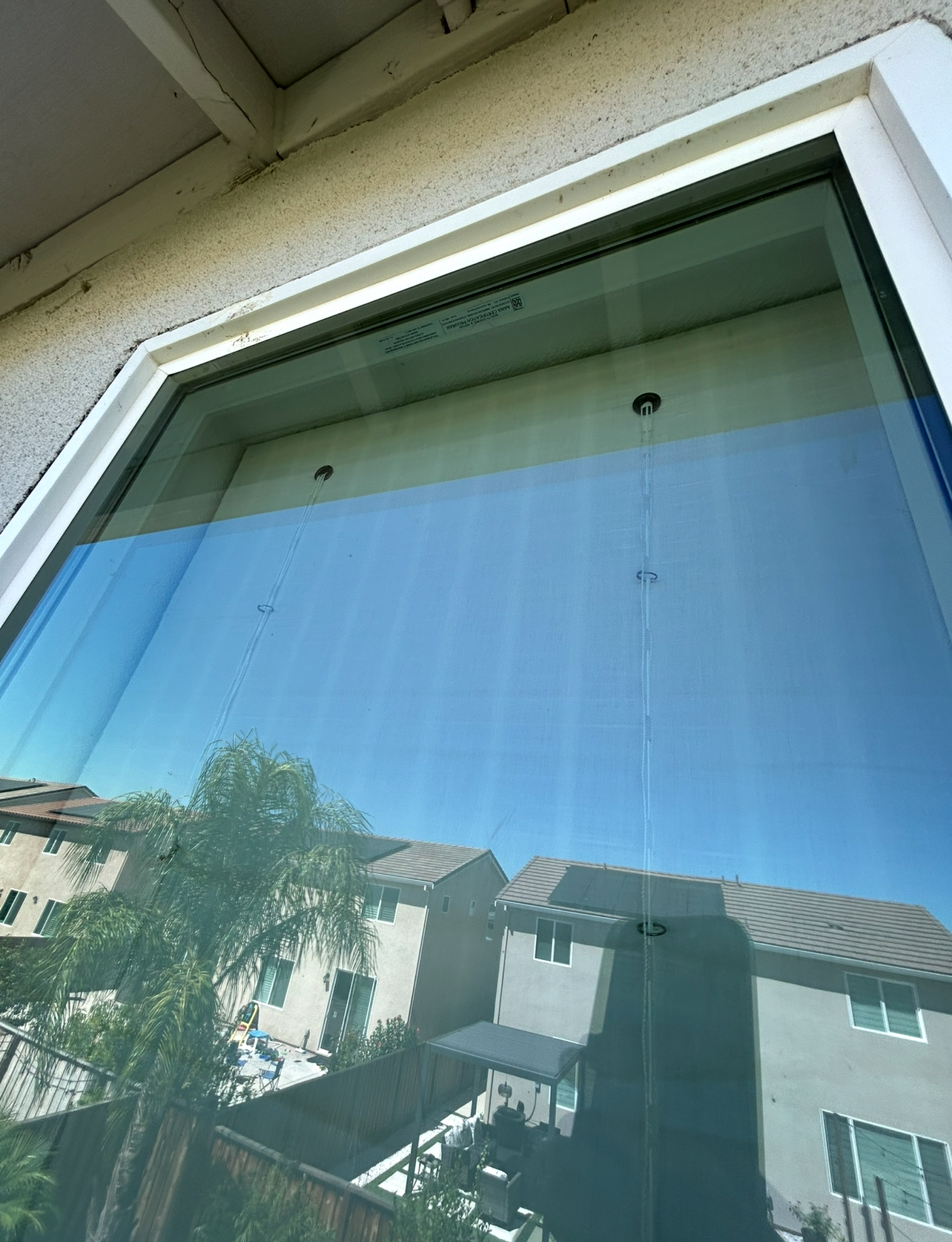 Upstairs glass with hard-water spotting after cleaning